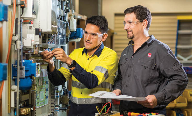 Photograph of student completely trade qualifications with practical training