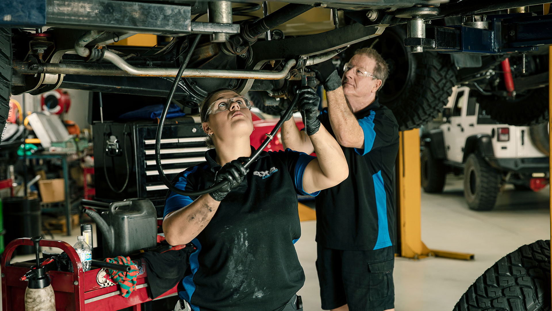 automotive apprentice working on car