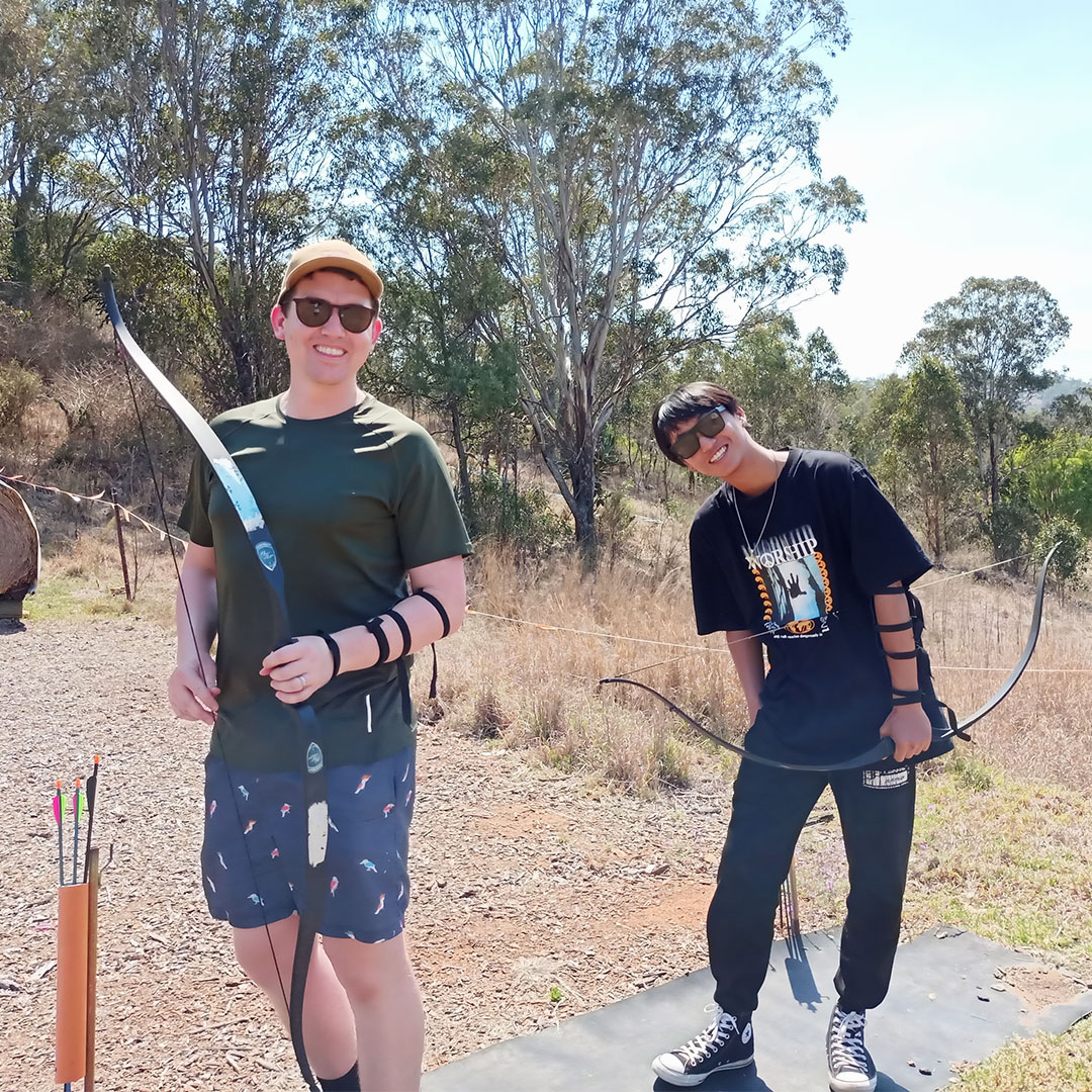 AMEP youth practice archery, at Camp Cooby