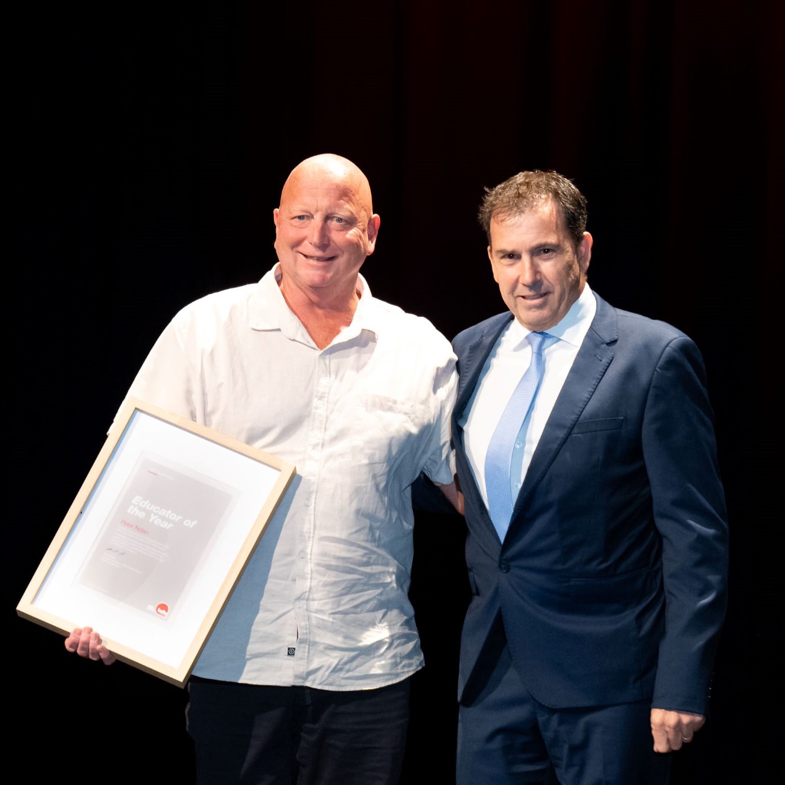 Educator of the Year Peter Nolan (L) accepts his award